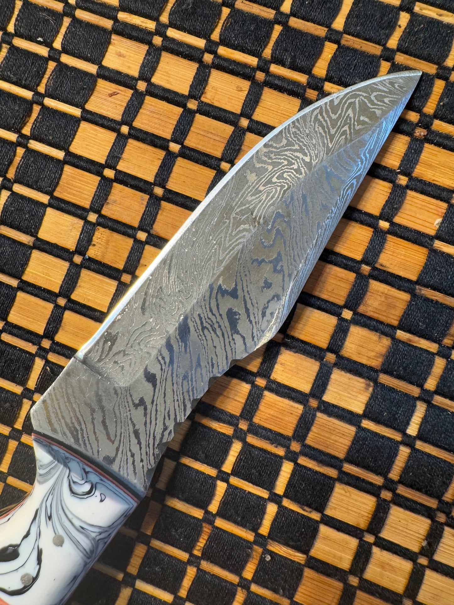 Damascus knife with leather sheath