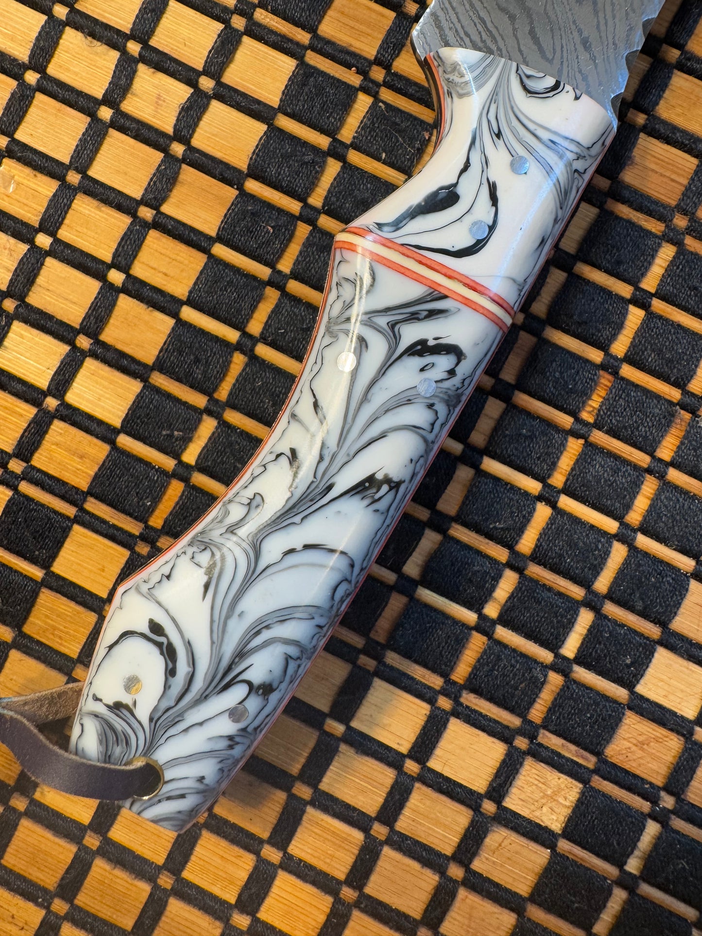 Damascus knife with leather sheath