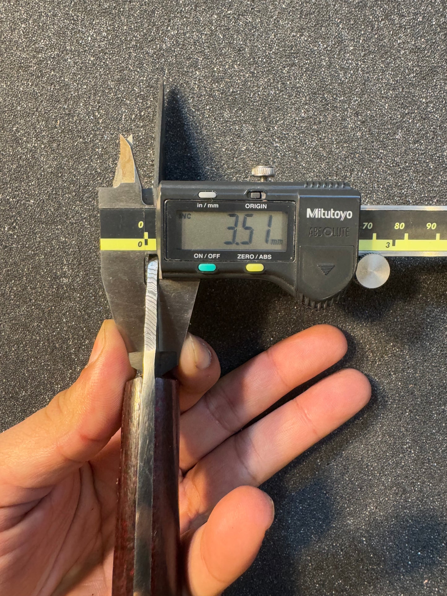 Damascus blade with micarta handle