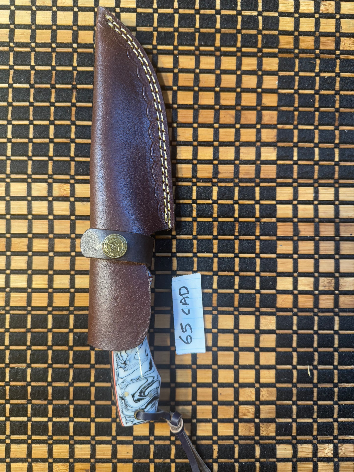 Damascus knife with leather sheath